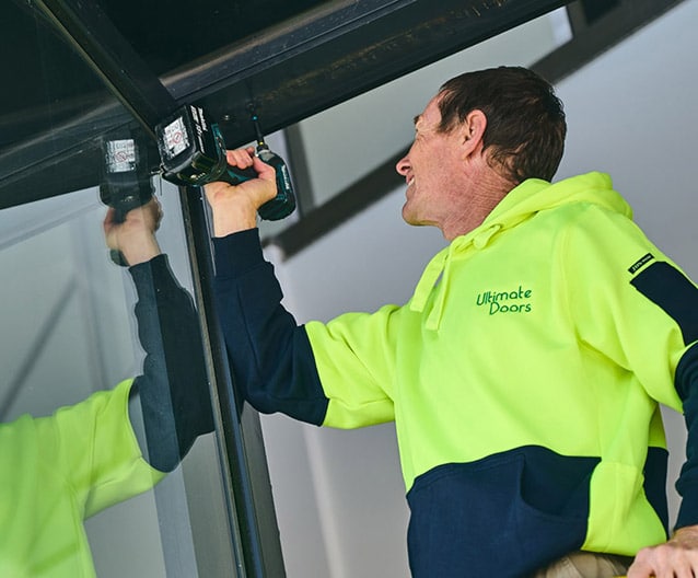 tradesman fixing door