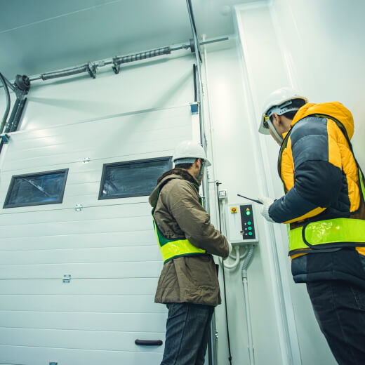 tradesmen checking door controls