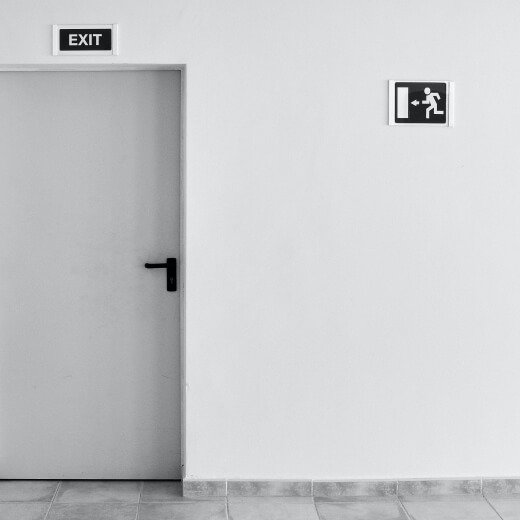 a white exit door with Exit sign