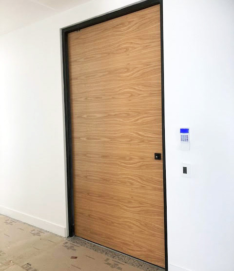 brown wood pivot door